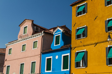 Fototapeta na wymiar The row of colorful houses in Burano street, Italy.