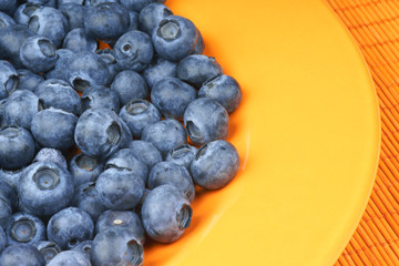 Blueberries in an orange plate