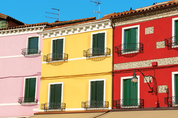 Colorful houses in a row on Burano Island, Venice, Italy