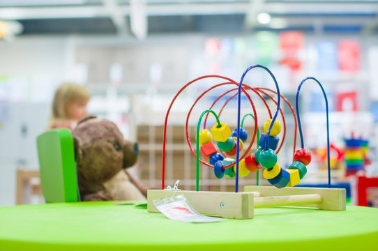 Logic toy with paths and spheres, cubes on table in mall