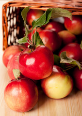 Red apples in a basket on the table