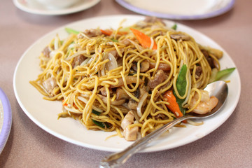 Plate of stir-fried chow mein at a Chinese restaurant.