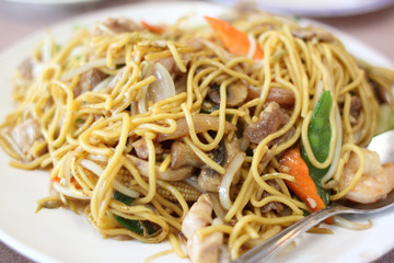 Plate of stir-fried chow mein at a Chinese restaurant.