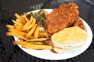 Fried chicken dinner with sides.