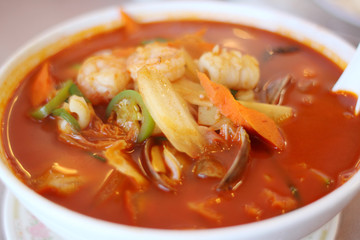 Bowl of spicy seafood soup at a Chinese restaurant.