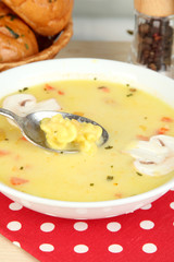 Fragrant soup in white plate on table close-up