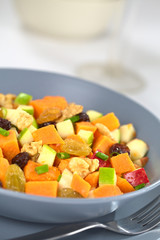 Salad made of sweet potato, apple, nut, raisin, shallot