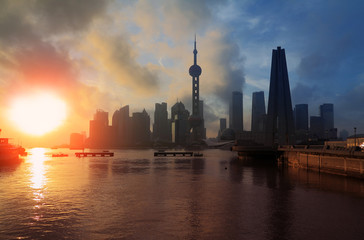 Fototapeta na wymiar Shanghai Skyline rising sun viewed from the Bund