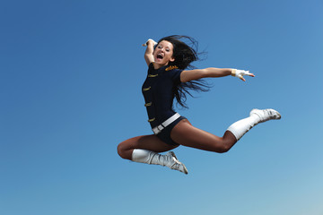 Young female dancer against white background