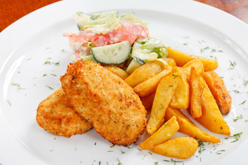 chicken cutlet with fried potatoes