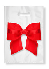 Plastic bag on white with red ribbon