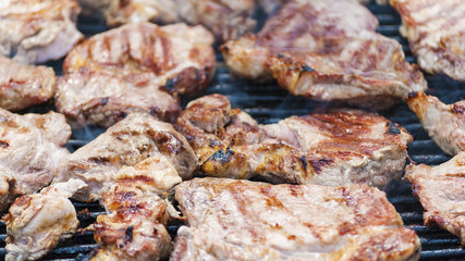 Steaks cooking on barbecue