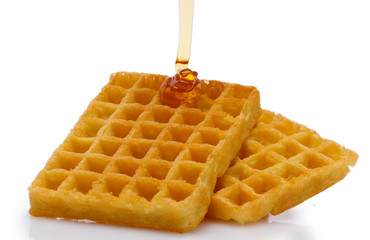 belgium waffles with honey isolated on white