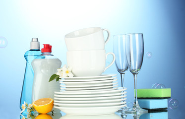 empty clean plates, glasses and cups with dishwashing liquid,