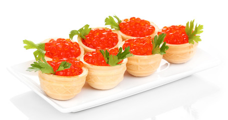 Red caviar in tartlets on white plate isolated on white