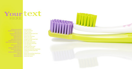 Two colored toothbrushes