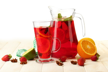 sangria in jar and glass with fruits,