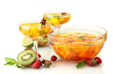 punch in bowl and glasses with fruits, isolated on white