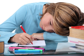Tired child doing homework