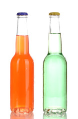 Tasty drinks in bottles isolated on white