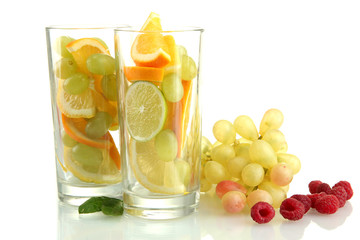 transparent glasses with citrus fruits, isolated on white