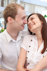 Young man looking at a woman on date