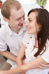 Young man looking at a woman on date