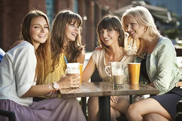 Foto auf Acrylglas A group of women in the coffee shop © konradbak