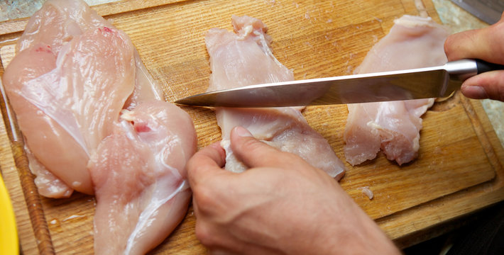 Cutting chicken meat