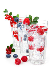 juice / cocktail with currant, blueberry and ice, isolated on wh
