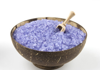 Lavender sea salt in coconut bowl on white