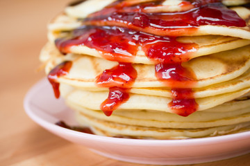 Pancakes with chockolate and strawberry sipup