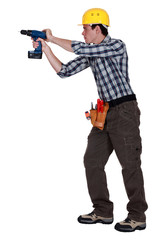 Man drilling into wall