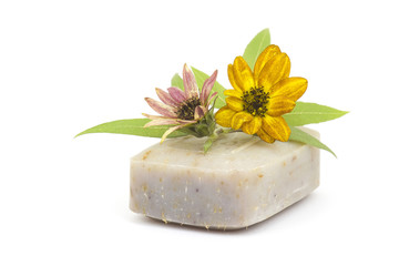 Obraz na płótnie Canvas bar of natural soap and flowers