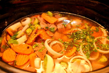 Stew Cooking in a Black Pot