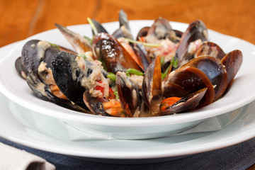 bowl with cooked mussels