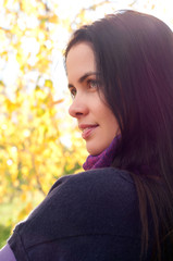 Portrait of young beautiful woman in the park