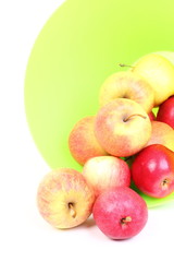 Fresh green, red apples in basket isolated