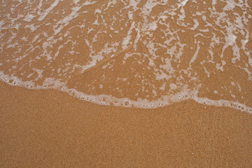 Sand and wave