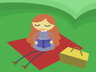 girl reading book in the meadow