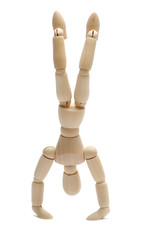 wooden doll standing on hands