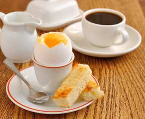 Fototapeta premium soft-boiled egg on a brown table