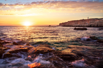Obraz premium Beautiful seascape. Sea and rock at the sunset.
