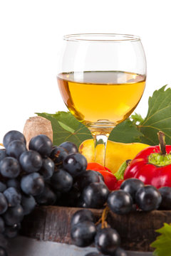 glass of white wine and various autumn fruits