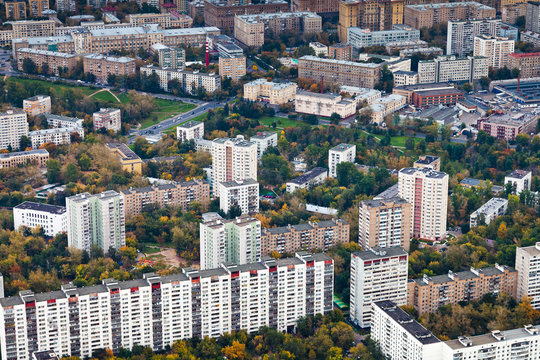 block of big modern houses in autumn day