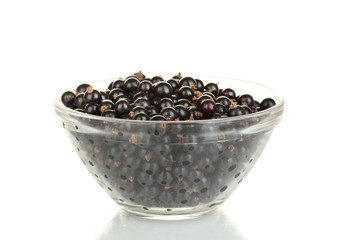 Fresh black currant in transparent bowl isolated on white