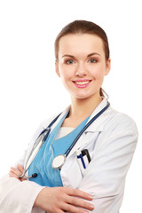 Fototapeta premium Happy young nurse standing with folded arms