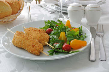 Chicken Schnitzel with arugula and cherry tomatoes