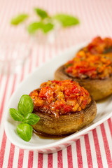 Stuffed mushrooms with basil leaves