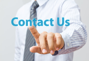 businessman hand pushing contact us
